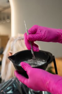 Salon artist controlling the hair coloring
